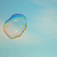 Image showing blowing bubble balloons on a field