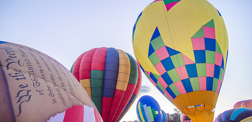 Image showing Colorful hot air balloons at festival 