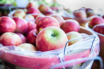 Image showing Large bushel basket full of fresh locally grown red apples at lo