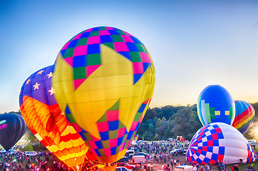 Image showing Bright Hot Air Balloons Glowing at Night