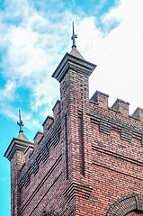 Image showing old brick church abuilding in a city