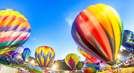 Image showing Bright Hot Air Balloons Glowing at Night