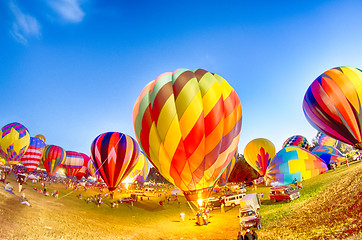 Image showing Bright Hot Air Balloons Glowing at Night