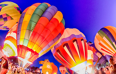 Image showing Bright Hot Air Balloons Glowing at Night