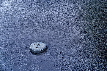 Image showing manhole cover in asphalt