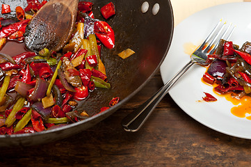 Image showing fried chili pepper and vegetable on a wok pan