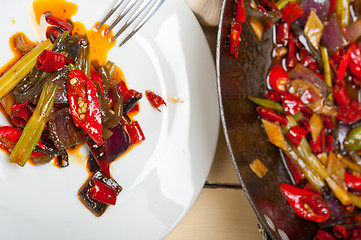 Image showing fried chili pepper and vegetable on a wok pan