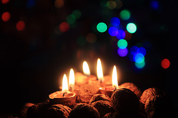 Image showing candle from the walnut shells - christmas tradition