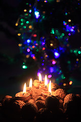 Image showing candle from the walnut shells - christmas tradition