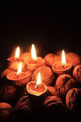 Image showing candle from the walnut shells - christmas tradition