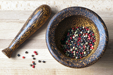 Image showing Red, black, green and white peppercorns