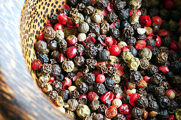 Image showing Red, black, green and white peppercorns