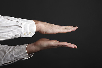 Image showing Caucasian male hands squeeze something