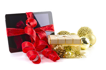 Image showing tablet pc with  christmas decorations on white 
