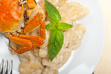 Image showing Italian gnocchi with seafood sauce with crab and basil