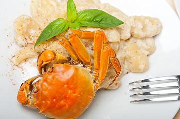 Image showing Italian gnocchi with seafood sauce with crab and basil