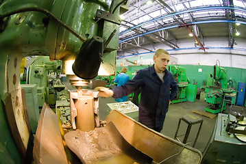 Image showing Young milling-machine operator works at machine