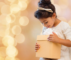 Image showing smiling little girl with gift box