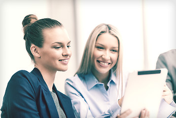 Image showing business team with tablet pc having discussion