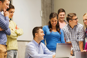 Image showing group of students and teacher with laptop