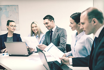 Image showing business team with laptop having discussion