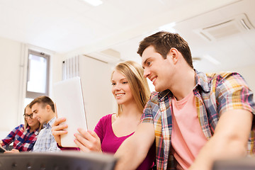 Image showing group of smiling students with tablet pc