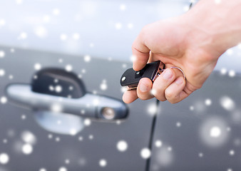 Image showing close up of man with car key outdoors