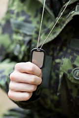 Image showing close up of young soldier in military uniform