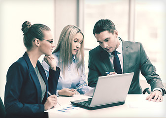 Image showing business team with laptop having discussion