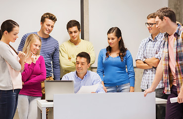 Image showing group of students and teacher with laptop