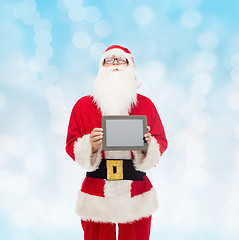 Image showing man in costume of santa claus with tablet pc