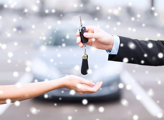 Image showing close up of man with car key outdoors