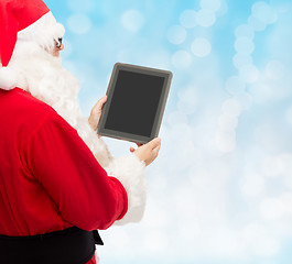 Image showing man in costume of santa claus with tablet pc