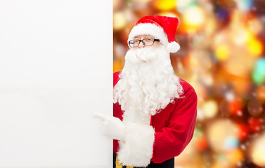 Image showing man in costume of santa claus with billboard