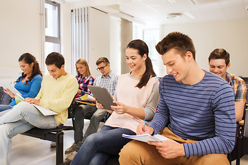 Image showing group of smiling students with tablet pc