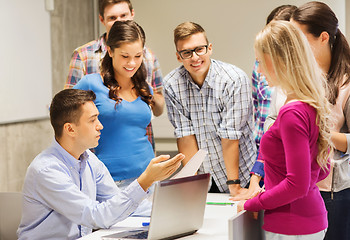 Image showing group of students and teacher with laptop