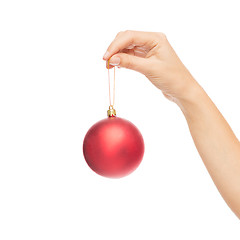 Image showing close up of woman in sweater with christmas ball