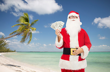 Image showing man in costume of santa claus with dollar money