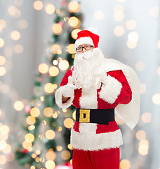 Image showing man in costume of santa claus with bag