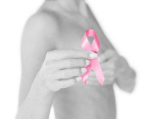 Image showing hand holding pink breast cancer awareness ribbon