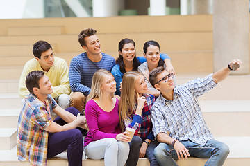 Image showing group of students with smartphone and coffee cup