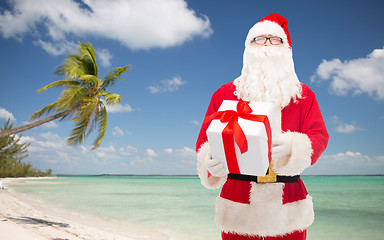 Image showing man in costume of santa claus with gift box