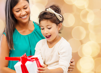 Image showing happy mother and little girl with gift box