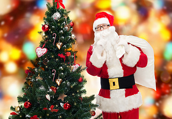 Image showing santa claus with bag and christmas tree