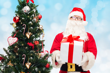 Image showing man in costume of santa claus with gift box