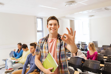 Image showing group of smiling students in lecture hall