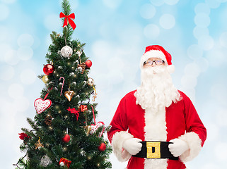 Image showing man in costume of santa claus with christmas tree