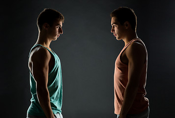 Image showing young men looking to each other