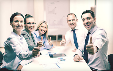 Image showing business team showing thumbs up in office