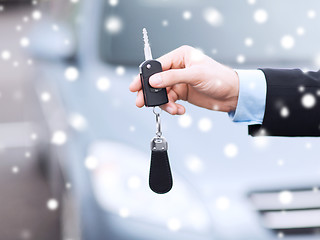 Image showing close up of man with car key outdoors